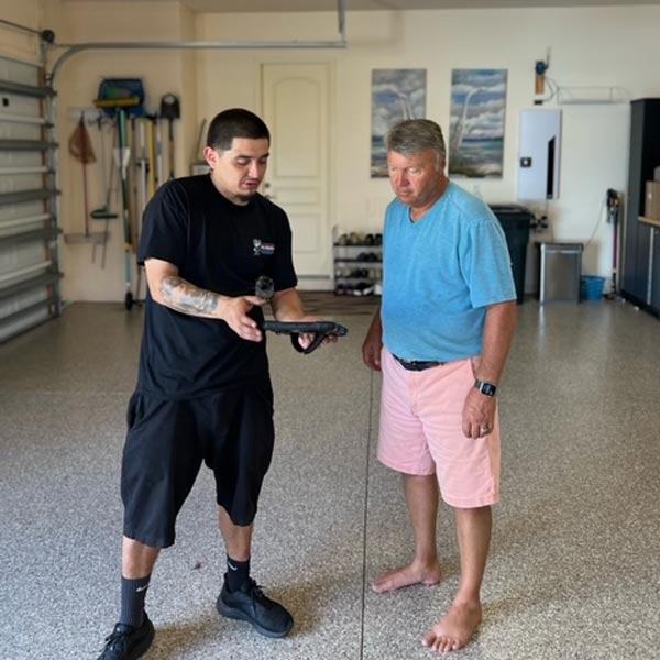 garage door technician with client